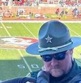 Photo Of Florida Deputy At Football Game Turns Heads, When You Zoom Out You’ll Realize Why.