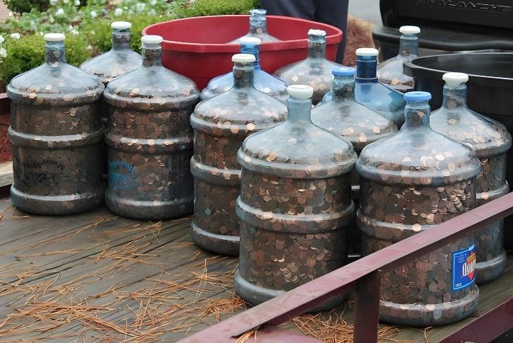 Man saves coins for 45 years, rolls 15 water jugs into bank and tells teller to deposit ’em all.